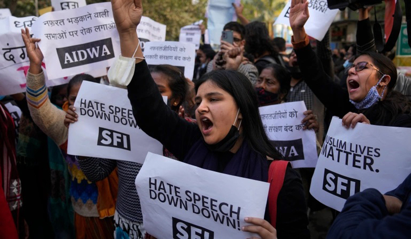 Activists shout slogans during a protest 